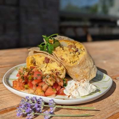 A Westside breakfast burrito cut open with fresh pico de gallo